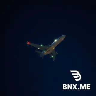 Photorealistic, night sky, deep dark blue with scattered faint stars, a commercial airplane flying at high altitude, navigation lights blinking — red and green wing lights, bright white landing lights glowing from the fuselage and wings, a subtle warm light from cabin windows visible. The plane is seen from below at a slight angle, moving across the sky. Soft light trails from the plane's lights against the dark background. No moon, slight haze, high resolution, ultra realistic, 8K, cinematic lighting, shot with a long exposure for light trails."