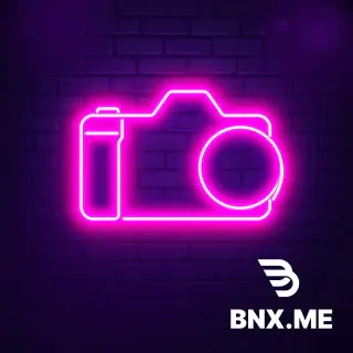 Neon sign logo for a photographer. The silhouette of a camera body or lens shape drawn in glowing magenta and cyan neon tubing. Realistic light bloom and haze effect on a dark charcoal brick wall background. Cyberpunk edge, music venue vibe, high resolution, ultra detailed --ar 2:1