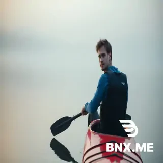 A cinematic, true-crime documentary style scene set just after sunrise on a calm lake in the late 2010s. Ryan Borgwardt, a 38-year-old Caucasian man with soft but focused facial features, light stubble, medium-length brown hair slightly tousled by a cool morning breeze, and thoughtful hazel eyes with a calm, analytical expression, is seen paddling alone across still water. He wears a fitted blue thermal long-sleeve shirt, a black kayaking life vest, and dark water-resistant pants. His red touring kayak cuts gently through the glass-like surface of the lake, surrounded by faint mist and pale early-morning light. The atmosphere feels tense and suspended, as if the water itself is holding its breath. Wide cinematic framing, cool muted tones, subtle fog, soft natural lighting, realistic documentary realism, quiet suspenseful mood, shallow ripples on the lake emphasizing isolation and foreboding.
